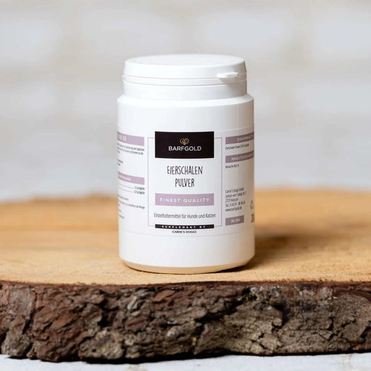 Eierschalenpulver 200 g Dose als natürliche Calciumquelle zur Unterstützung der Knochengesundheit bei Hunden und Katzen, platziert auf einem Holzbrett.